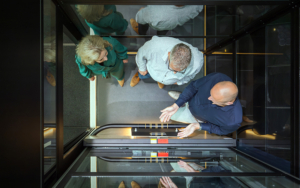 People Looking At Buying An Elevator